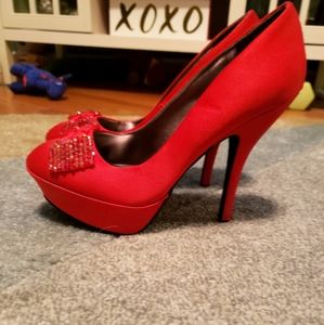 Ruby red pumps with bowtie